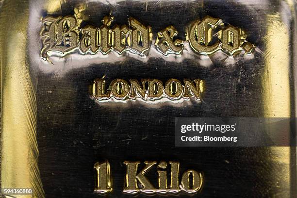 Kilo gold bar sits on display at the Baird & Co. Ltd. Precious metals refinery in London, U.K., on Wednesday, Aug. 3, 2016. Baird & Co., which buys...