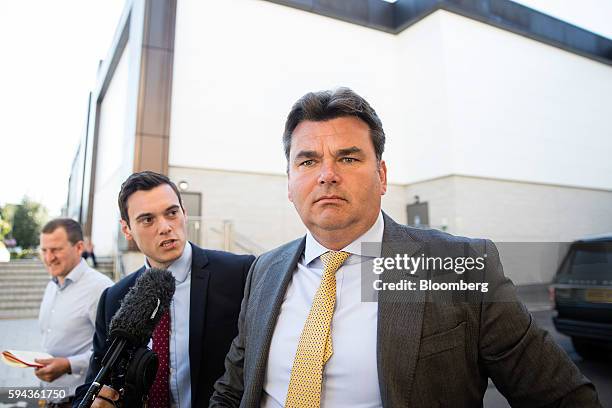 Dominic Chappell, former owner of BHS Ltd., right, arrives to a attend a hearing in his speeding case at Aldershot Magistrates' Court in Aldershot,...