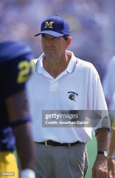 Head Coach Lloyd Carr of the Michigan Wolverines walks on the field during the game against the Bowling Green Falcons at the Michigan Stadium in Ann...