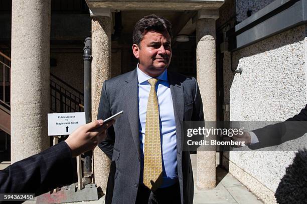 Dominic Chappell, former owner of BHS Ltd., speaks to members of the media after attending a hearing in his speeding case at Aldershot Magistrates'...