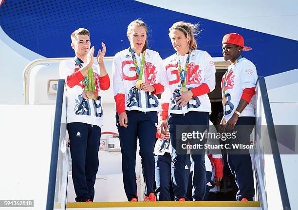 Team GB Gymnast and gold medallist Max Whitlock and gold medallist and boxer Nicola Adams look on as members of the women's hockey team leave the...