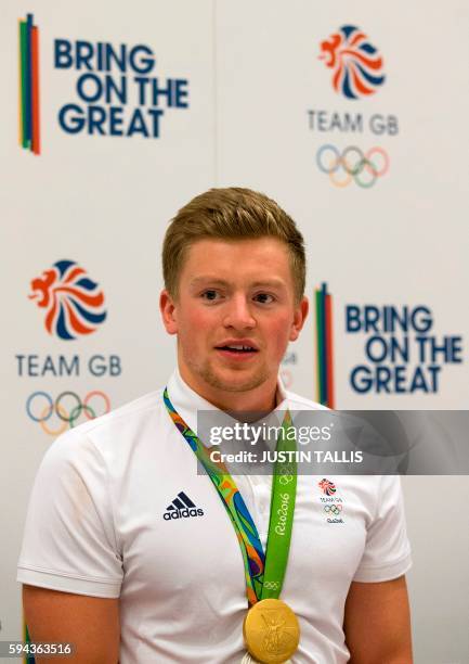 Britain's gold medal winning swimmer Adam Peaty speaks to members of the media at a press conference after arriving back from the Rio 2016 Olympic...