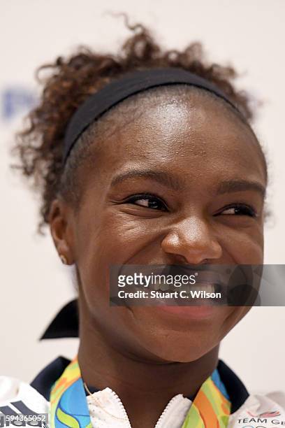 Bronze medalist Dina Asher-Smith speaks to journalists during the Team GB press conference at the Sofitel, Heathrow Airport on August 23, 2016 in...