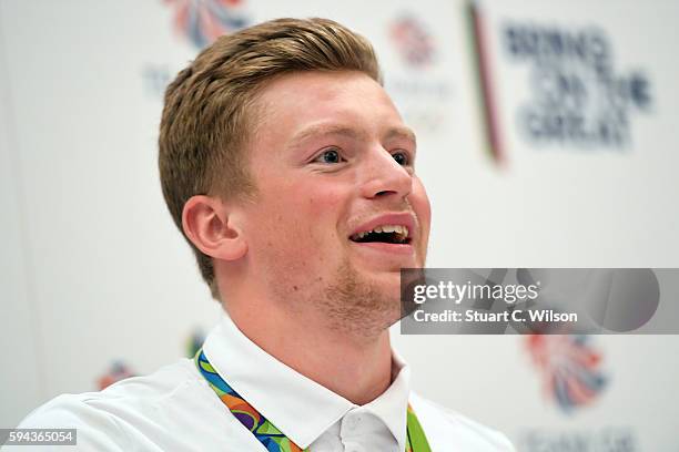 Gold medalist Adam Peaty speaks to journalists during the Team GB press conference at the Sofitel, Heathrow Airport on August 23, 2016 in London,...