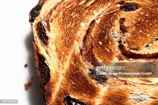 toasted slice of cinnamon raisin bread - raisin toast stock pictures, royalty-free photos & images