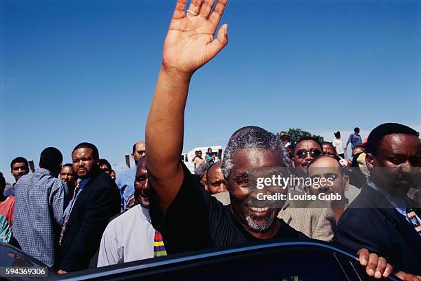 Presidential candidate Thabo Mbeki waves to supporters while campaigning near Cape Town, South Africa. | Location: near Cape Town, South Africa.