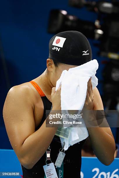 Kanako Watanabe of Japan reacts after competing in the Women's 200m Breaststroke semifinal on Day 5 of the Rio 2016 Olympic Games at the Olympic...