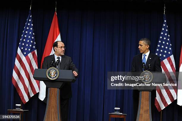 President Barack Obama and Prime Minister Nouri al-Maliki of Iraq at the White House hold a joint press conference to discuss the final troops being...