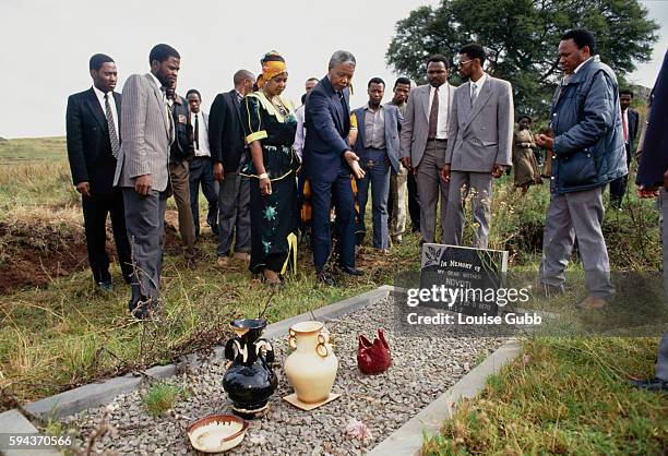 Nelson Mandela says a prayer over his mother's grave. Former President of South Africa and longtime political prisoner, Nelson Mandela, was held by...
