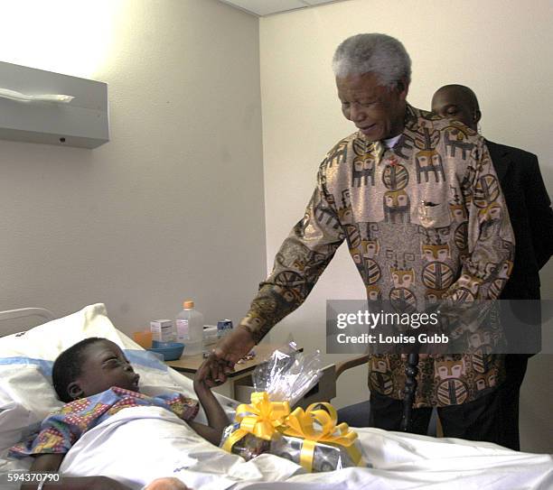 After officially opening the new Walter Sisulu Pediatric Cardiac Center for Africa, Nelson Mandela visits a few of the children already being treated...