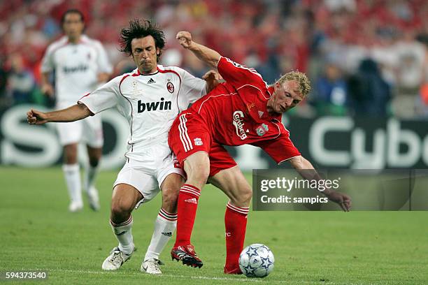 Andrea Pirlo of MIlan and Dirk Kuyt of Liverpool