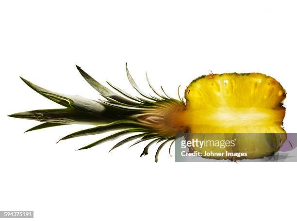 half of pineapple on white background - ananas photos et images de collection