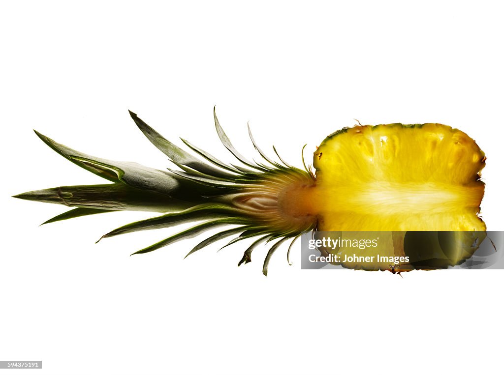 Half of pineapple on white background