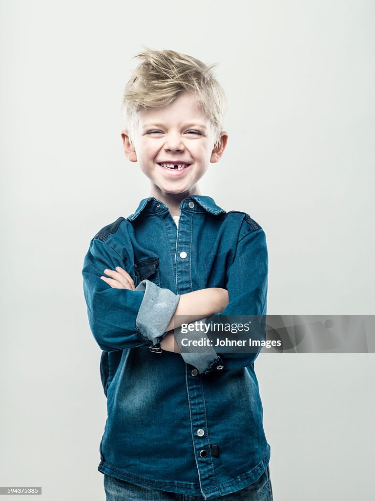 Boy with crossed arms