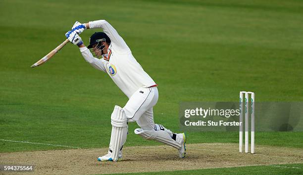 Durham batsman Jack Burnham drives during day one of the Specsavers County Championship Division One match between Durham and Warwickshire at the...