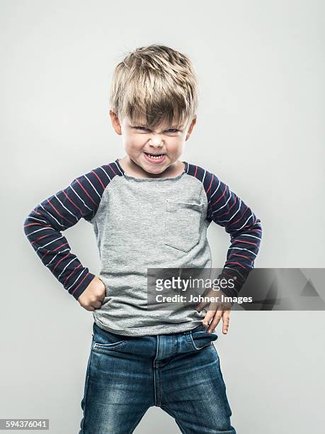 portrait of angry boy - misbehaving children stock pictures, royalty-free photos & images