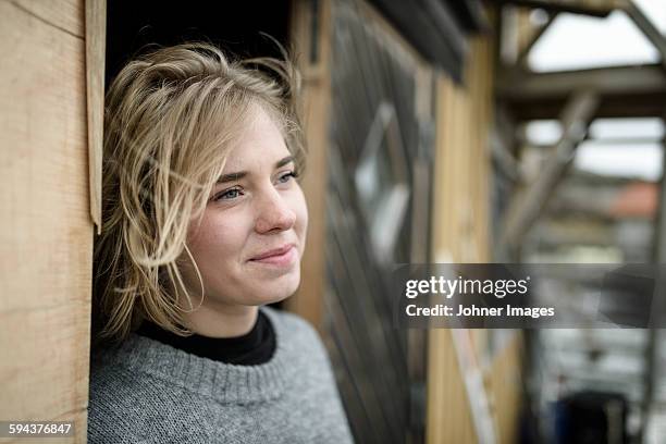smiling woman looking away - grebbestad stockfoto's en -beelden