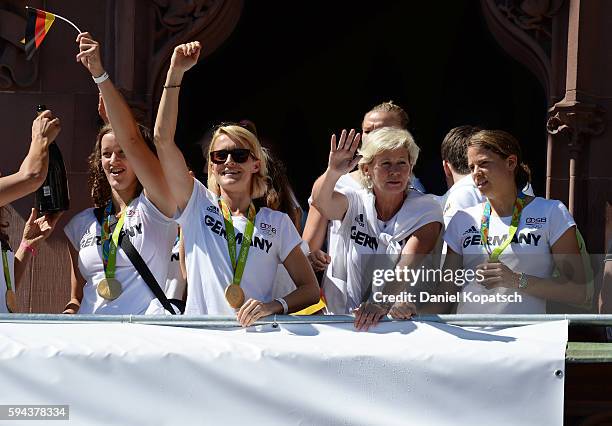 Almuth Schult , Saskia Bartusiak, Silvia Neid and Annike Krahn celebrate during the German Olympic Team Welcome Home Reception on August 23, 2016 in...