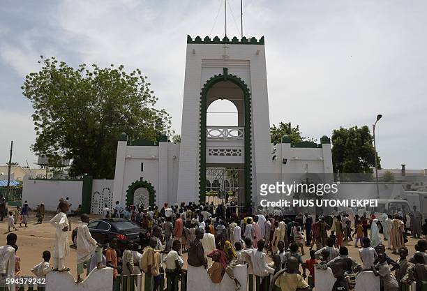 People gather to catch a glimpse of the visiting US Secretary of State John Kerry during his visit to the Sultan of Sokoto and President-General of...