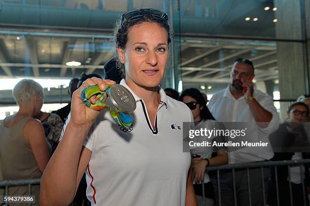 Melina Robert-Michon, discus silver medalist, arrives at Roissy Charles de Gaulle airport after the Olympic Games in Rio on August 23, 2016 in Paris,...