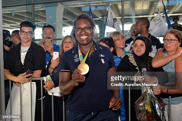 Emilie Andeol, judo gold medalist, arrives at Roissy Charles de Gaulle airport after the Olympic Games in Rio on August 23, 2016 in Paris, France....