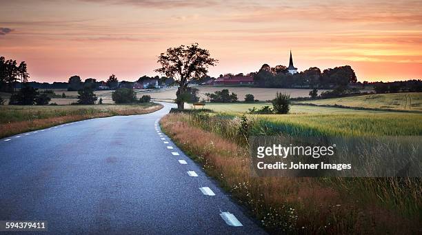 country road at sunset - church sunset rural scene stock pictures, royalty-free photos & images