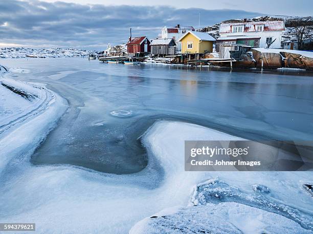 costal houses, frozen sea on foreground - archipelago stockfoto's en -beelden