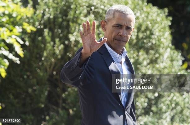 President Barack Obama walks to Marine One prior to departure from the South Lawn of the White House in Washington, DC, August 23, 2016. - President...