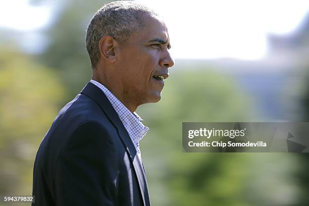 President Barack Obama walks across the South Lawn before boarding Marine One and departing the White House August 23, 2016 in Washington, DC. Obama...