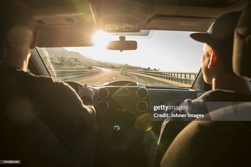 Father with son driving in car