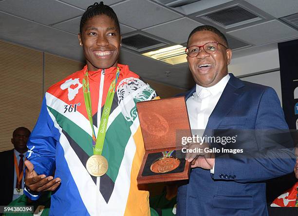 Sports and Recreation Minister Fikile Mbalula poses with 800m gold winner Caster Semenya at the OR Tambo airport during the arrival of the SA...