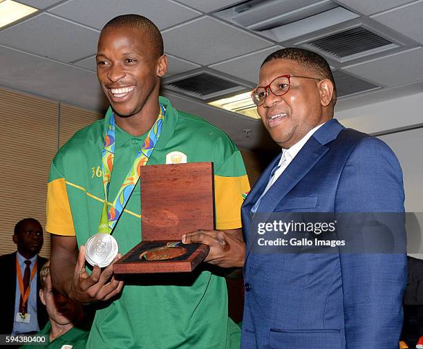 Sports and Recreation Minister Fikile Mbalula poses with silver medallist Luvo Manyonga at the OR Tambo airport during the arrival of the SA...