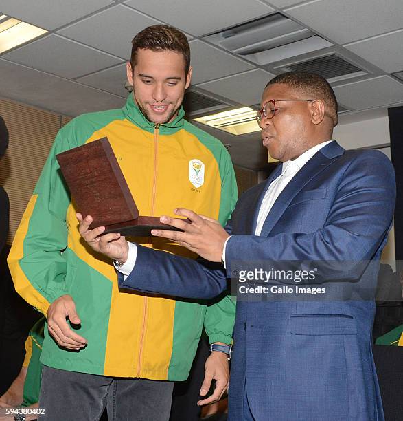 Sports and Recreation Minister Fikile Mbalula poses with silver medallist Chad Le Clos at the OR Tambo airport during the arrival of the SA Athletics...