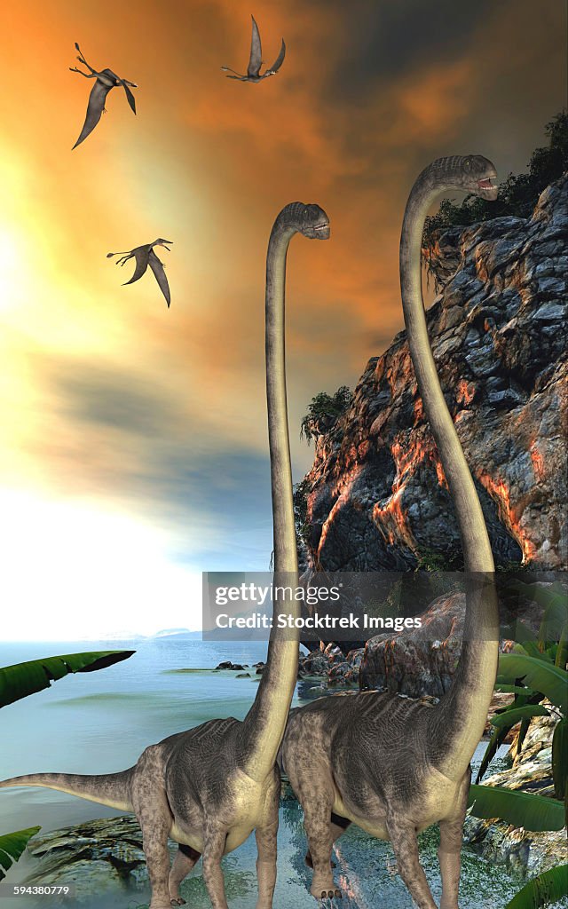 Two Omeisaurus dinosaurs walking along a steep cliff with Dorygnathus reptiles flying overhead.