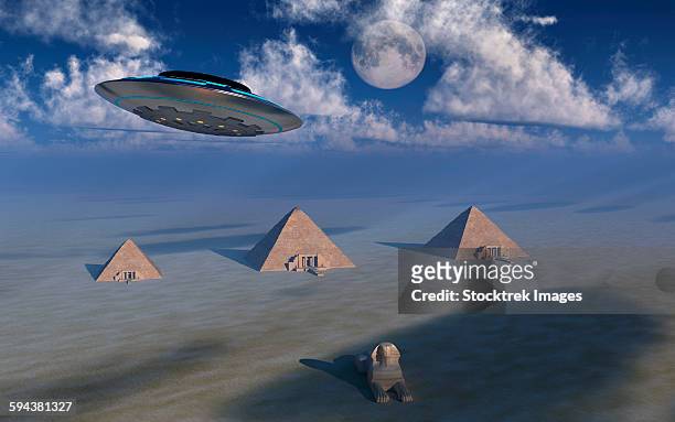 a ufo flying over the giza plateau in egypt. - out of context stock illustrations