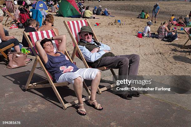 Holidaymakers bask in the sunshine and enjoy the fine weather on the North Wales coast at Llandudno on August 23, 2016 in Llandudno, Wales. As many...