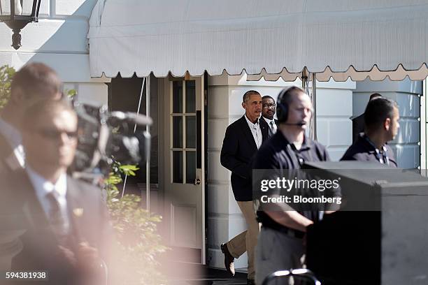 President Barack Obama, center, walks to Marine One as he departs from the White House in Washington, D.C. On Tuesday, Aug. 23, 2016. Obama will...