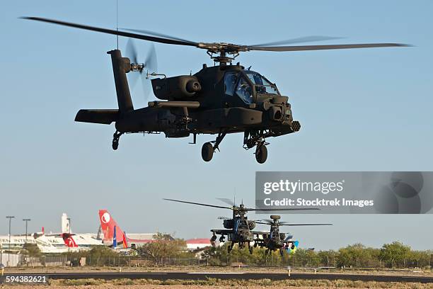 ah-64d apache longbow helicopters taking off on a mission in support of exercise angel thunder 2013. - ah 64 longbow stock pictures, royalty-free photos & images