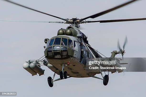 a mil mi-17 helicopter of the czech air force in flight over hradec kralove, czech republic. - helicóptero militar imagens e fotografias de stock