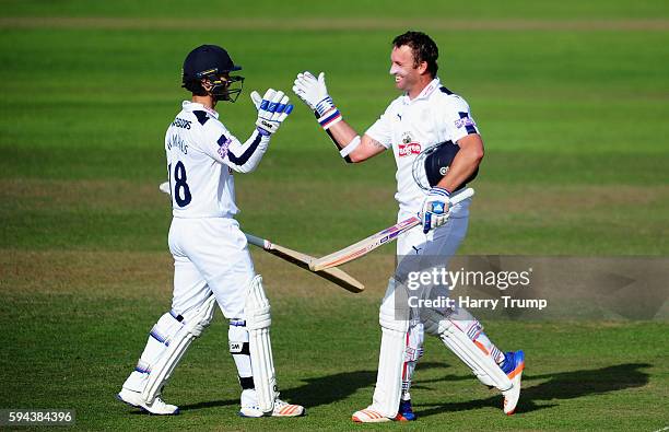 Sean Ervine of Hampshire celebrates his century during Day One of the Specsavers County Championship Division One match between Somerset and...