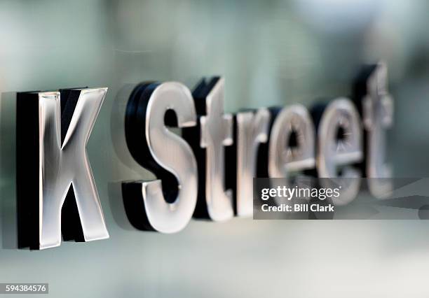 Street lettering marks the entrance to an office building in downtown Washington, DC on August 23, 2016. K Street is the center of the political...