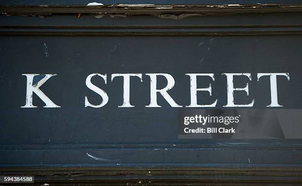 Street is written above the entrance to an office building in downtown Washington, DC on August 23, 2016. K Street is the center of the political...