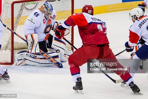 Alexei Yefimenko of Yunost-Minsk shot on goal of Victor Andren of Vaxjo Lakers during the 1st period of the Champions Hockey League group stage game...