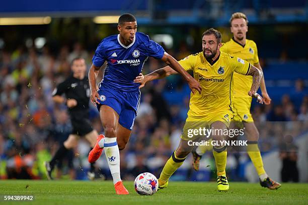 Chelsea's English midfielder Ruben Loftus-Cheek takes on Bristol Rovers' English defender Peter Hartley during the English League Cup second round...