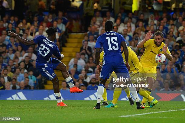 Chelsea's Belgian striker Michy Batshuayi scores the opening goal during the English League Cup second round football match between Chelsea and...
