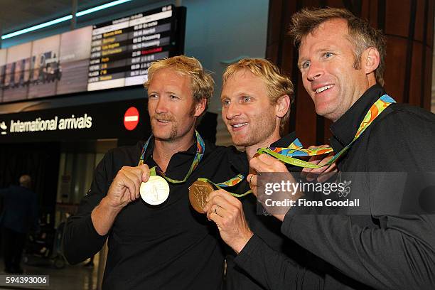 Olympic rowing gold medalists Eric Murray Hamish Bond and Mahe Drysdale with their medals during the New Zealand Olympic Games athlete home coming at...