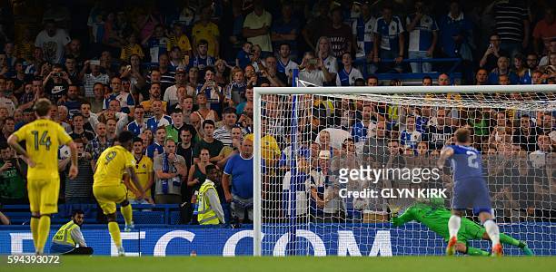 Bristol Rovers' Welsh midfielder Ellis Harrison fires in their second goal from the penalty spot past Chelsea's Bosnian goalkeeper Asmir Begovic...