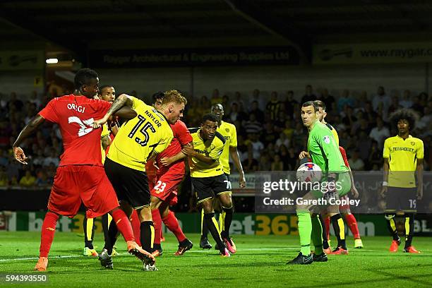 Tom Naylor of Burton Albion scores an own goal for Liverpool's third goal during the EFL Cup second round match between Burton Albion and Liverpool...