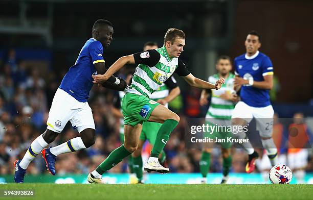 Ryan Hedges of Yeovil Town is challenged by Idrissa Gueye of Everton during the EFL Cup second round match between Everton and Yeovil Town at...