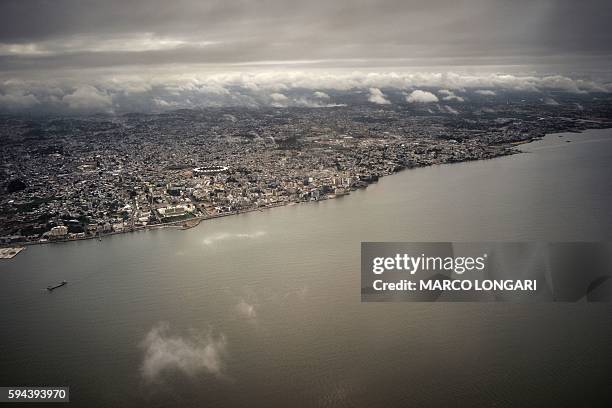 Picture taken on August 23, 2016 shows an aerial view of the waterfront of the Gabon capital Libreville. / AFP / MARCO LONGARI